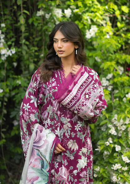 Woman wearing a purple floral outfit with a matching dupatta in a garden setting