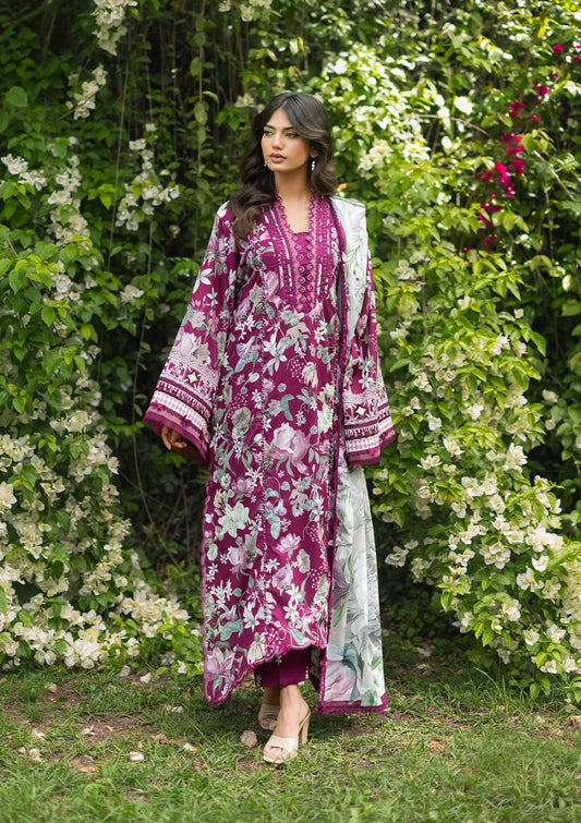 Woman wearing a floral dress with a matching dupatta in a garden setting