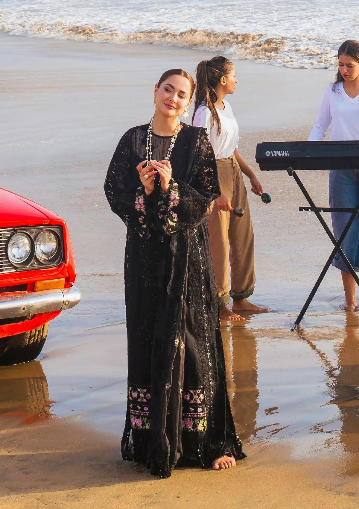 Mahnoor a black dress filled with luxury from ELAF's 'HAI KUCH' Festive 2024 Collection.